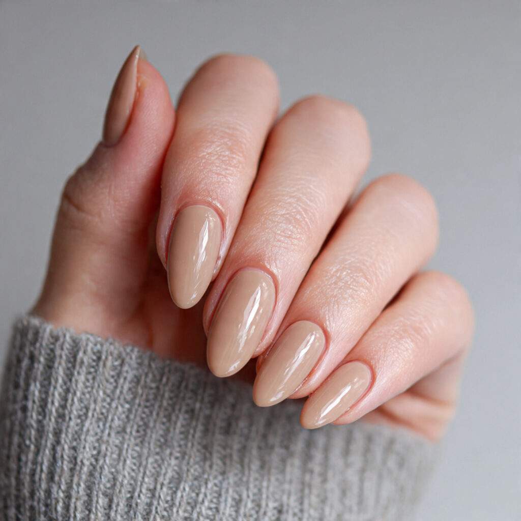 a warm neutral almond colored nail design suitable