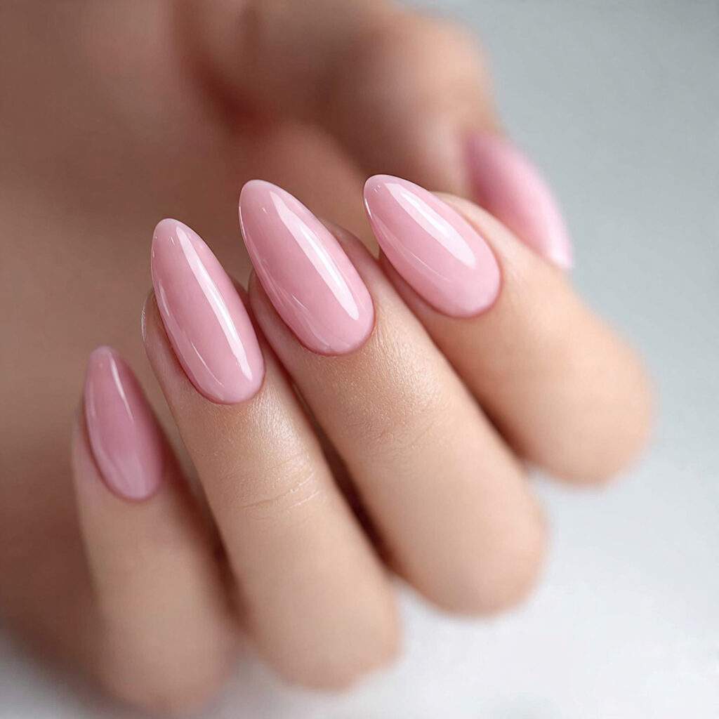almond shaped nails finished with sheer pink or