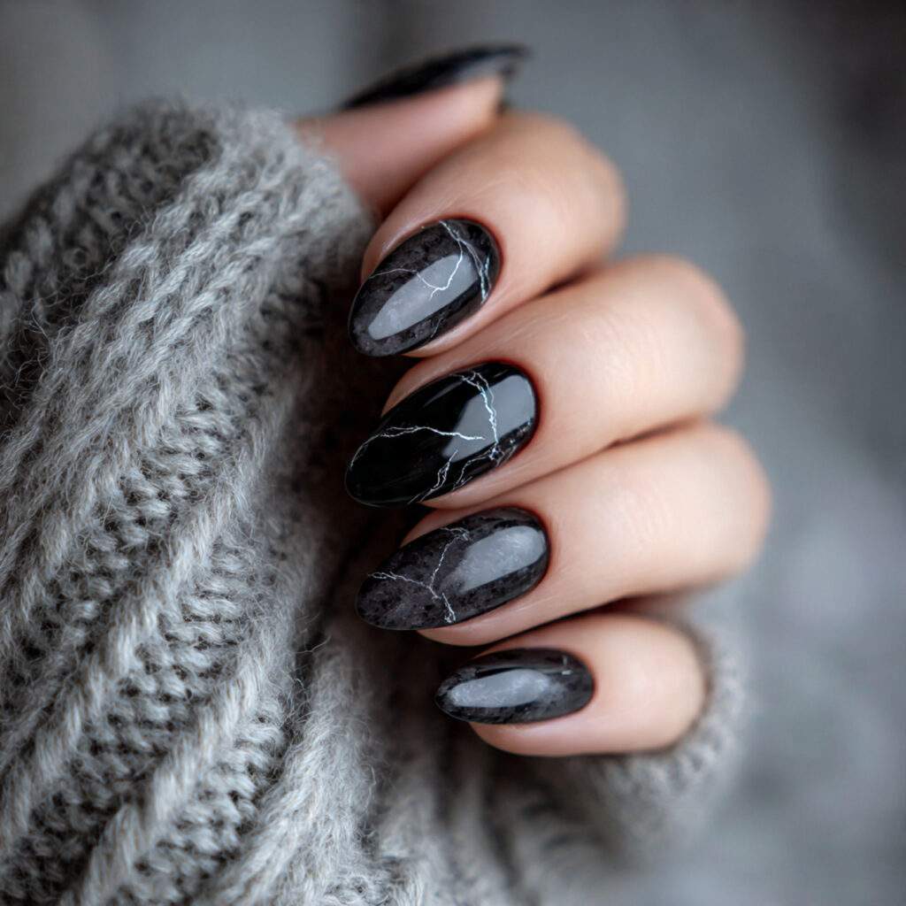 black nails with a subtle marble effect