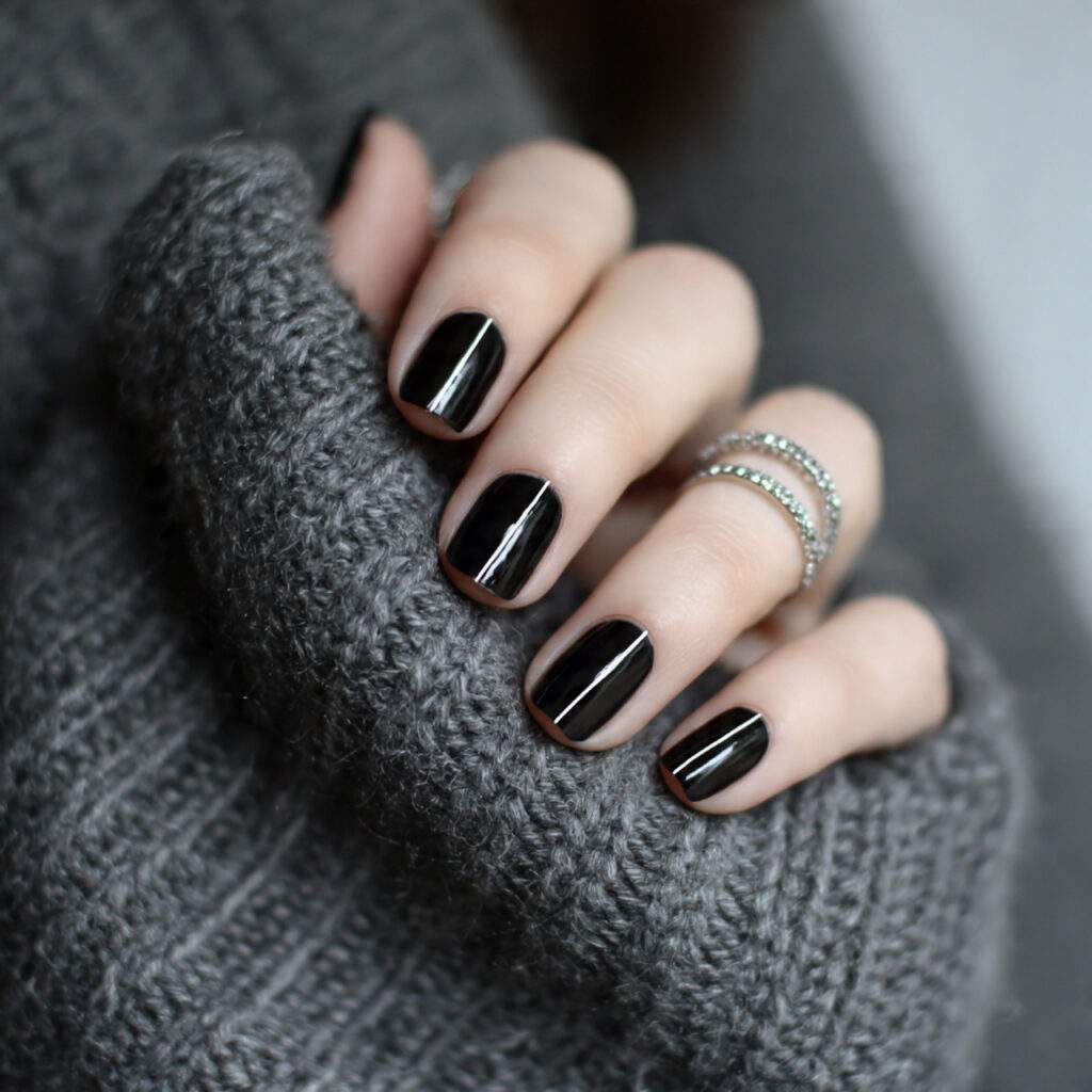black nails with minimal line designs add