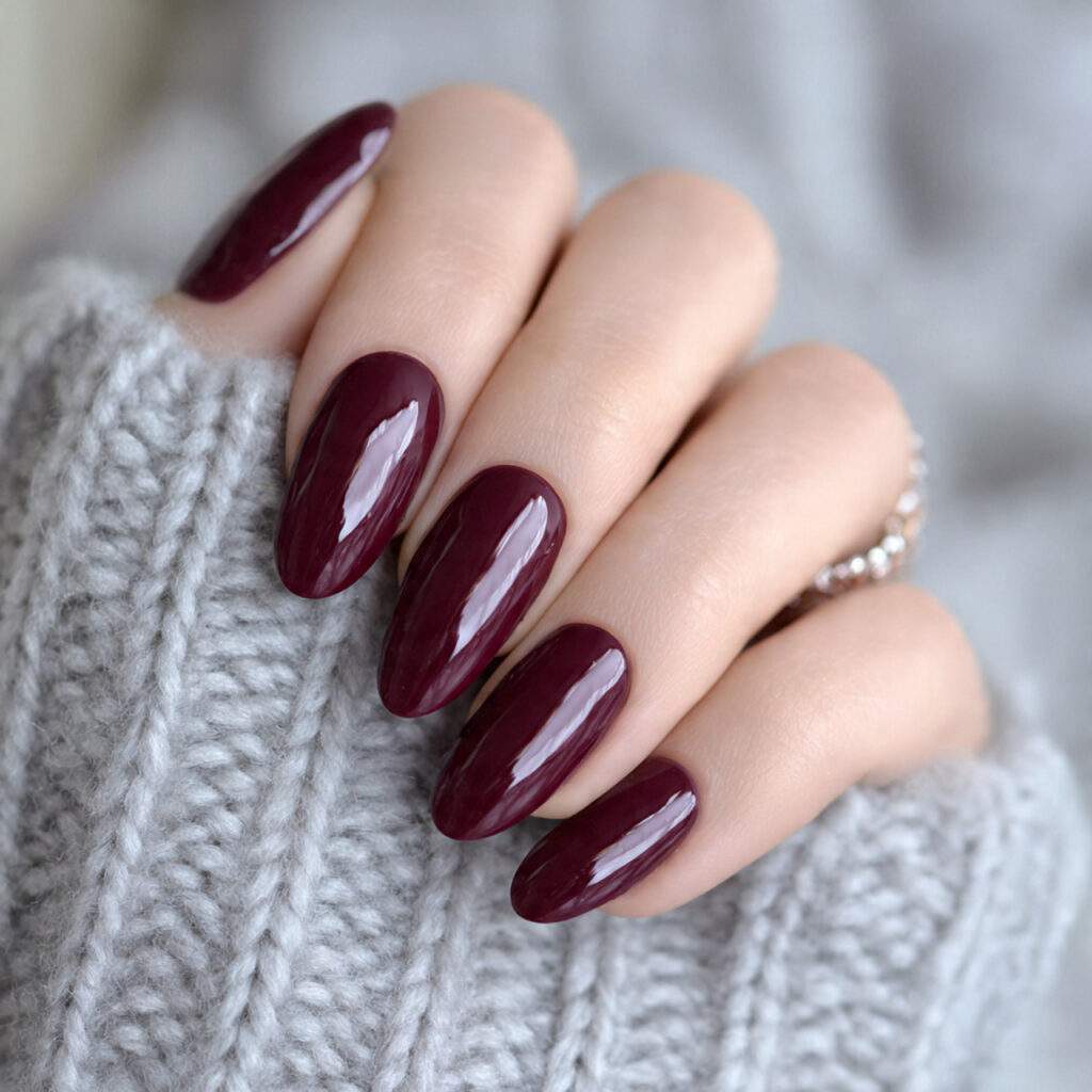 burgundy oval nails create a feminine and