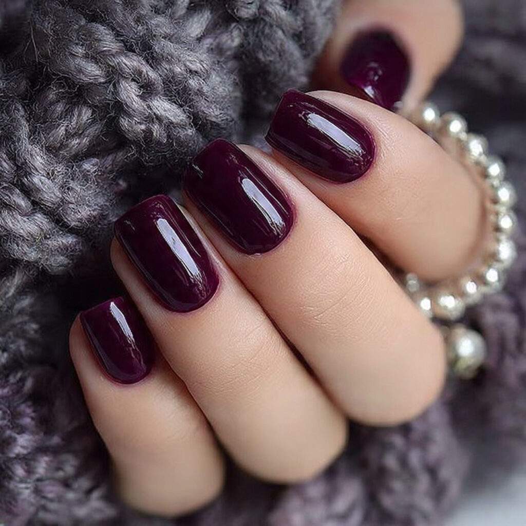 deep plum colored nails with rich glossy or 1
