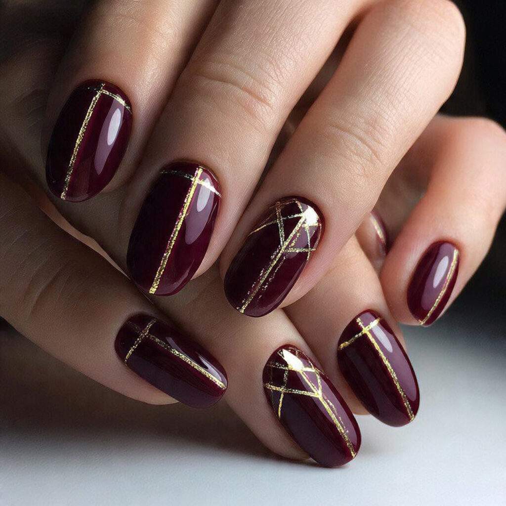 golden geometric burgundy nails feel bold and