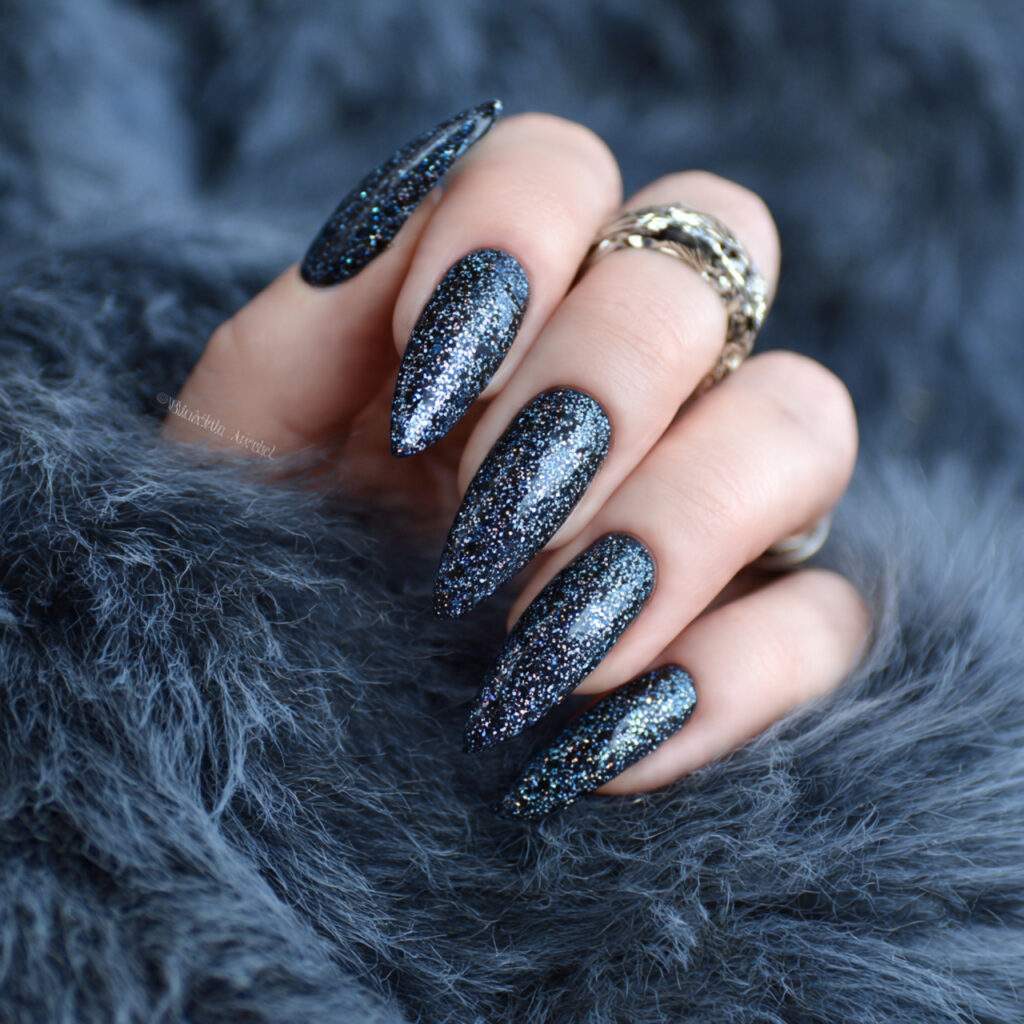 midnight blizzard sparkle stiletto nails feel bold