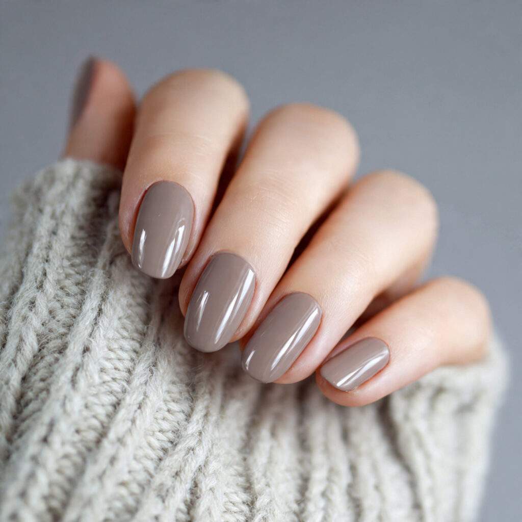 nails in a cool toned taupe shade with