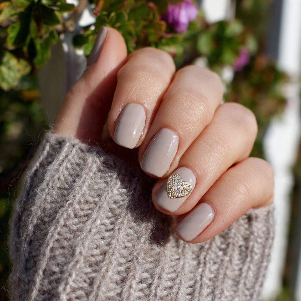 neutral heart nails with a single accent