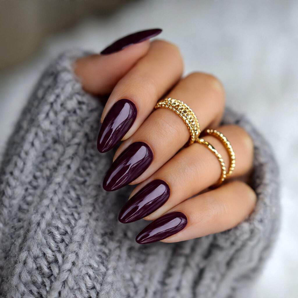 plum nails are dark purple with a